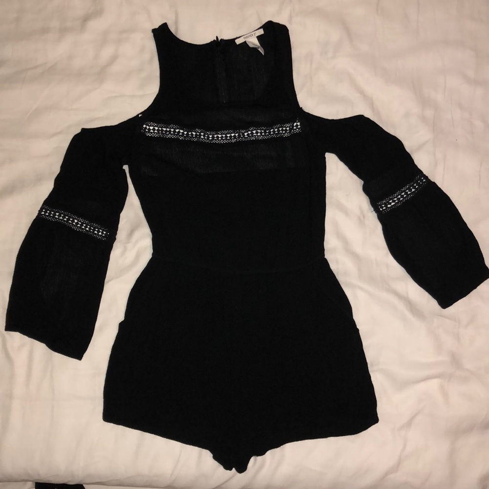 Black romper with shoulder cutouts